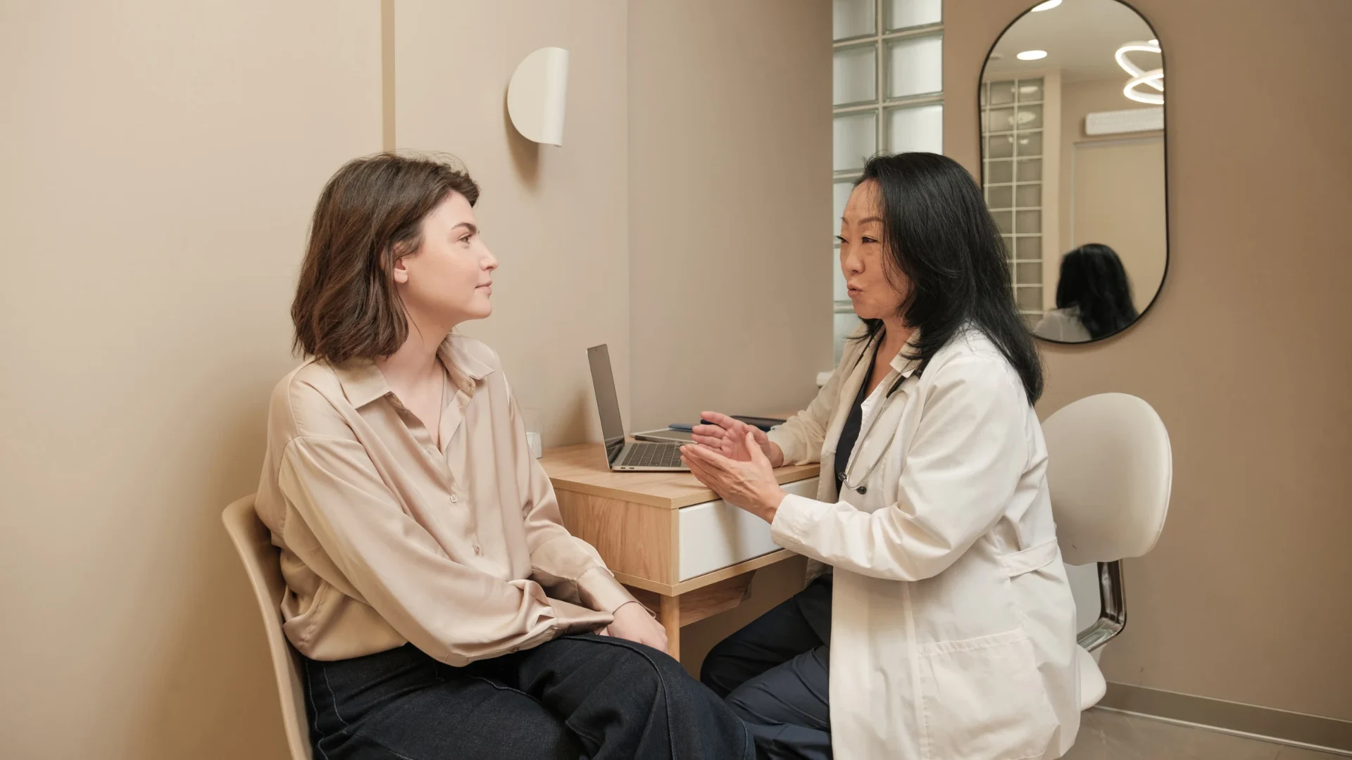 chronic-pain-treatment-options-multimodal-approach Healthcare provider discussing chronic pain treatment options with a patient during a medical consultation.